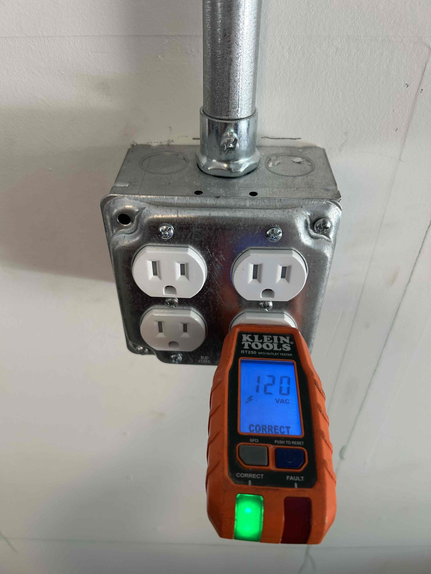Testing a newly installed GFCI outlet in a Durham garage