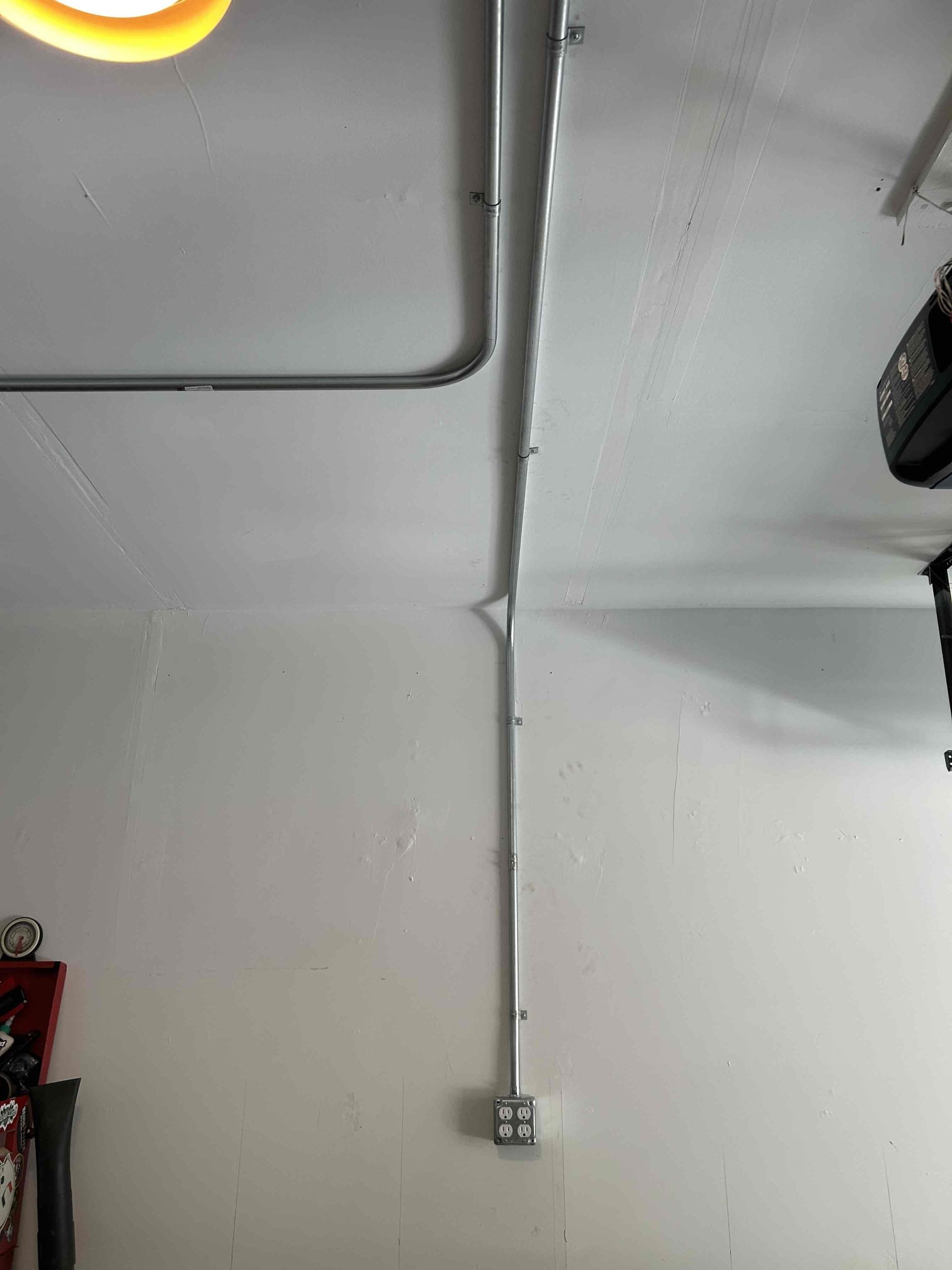 Professional metal conduit installation in a Durham garage