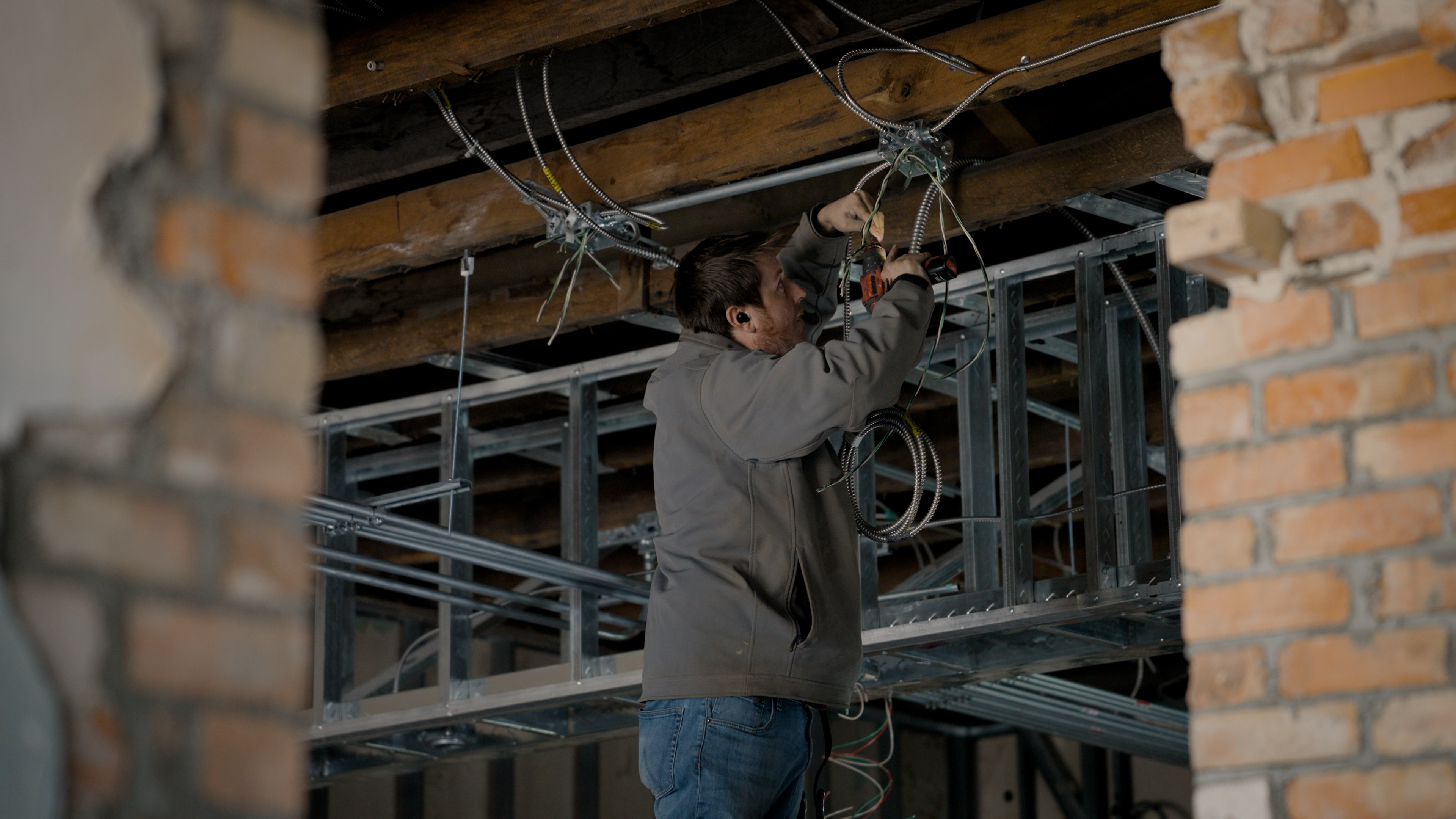 Touchstone Electric electrician installing electrical equipment