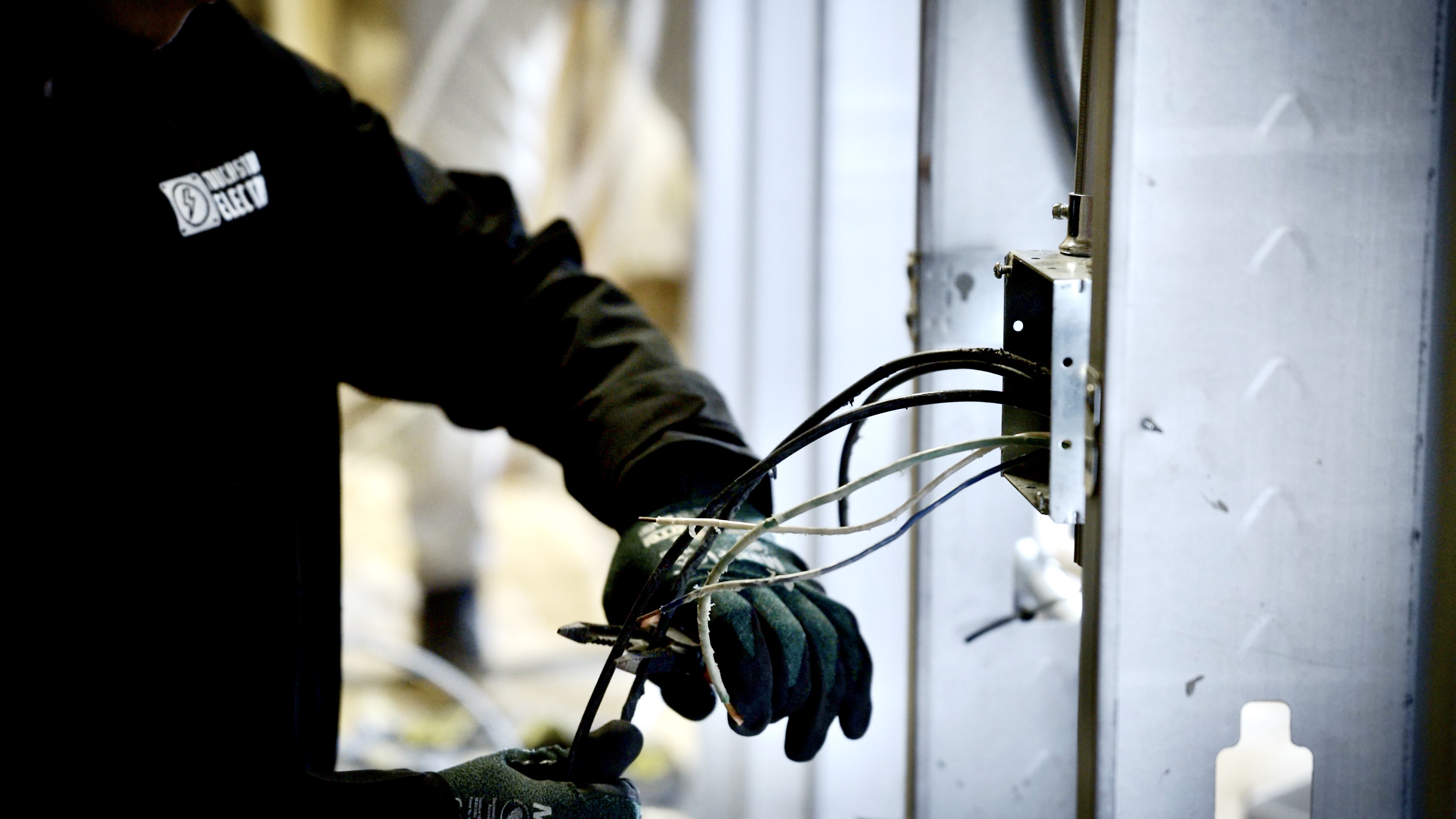 Touchstone Electric electrician wiring a residential subpanel