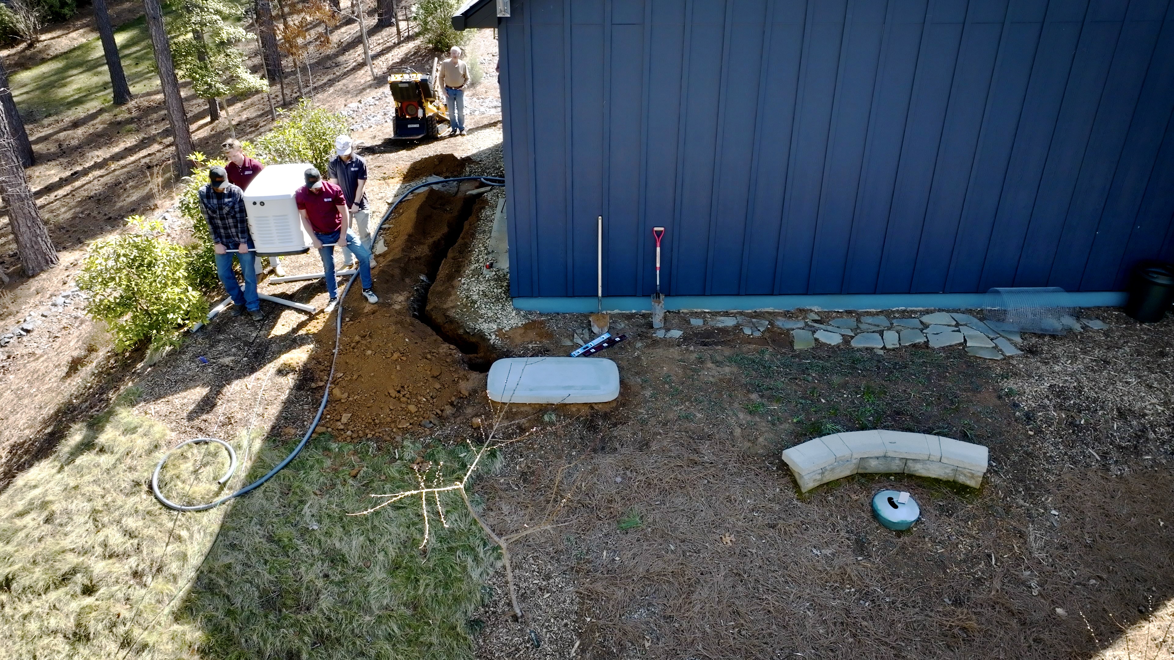 Touchstone Electric technician installing a whole-home generator